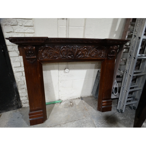 768 - An Antique Style Mahogany Finish Fire Surround