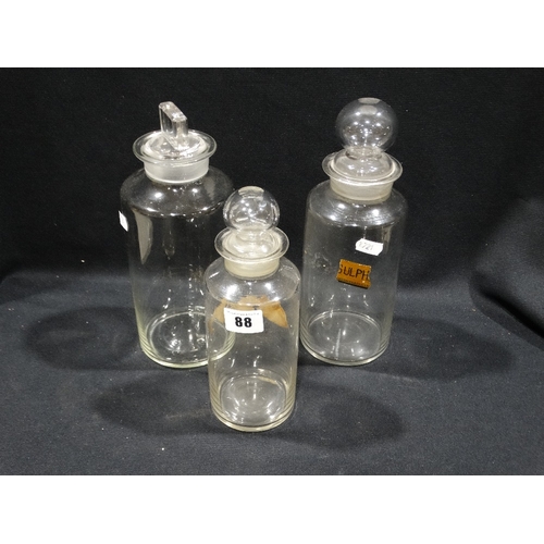88 - Three Clear Glass Chemists Bottles