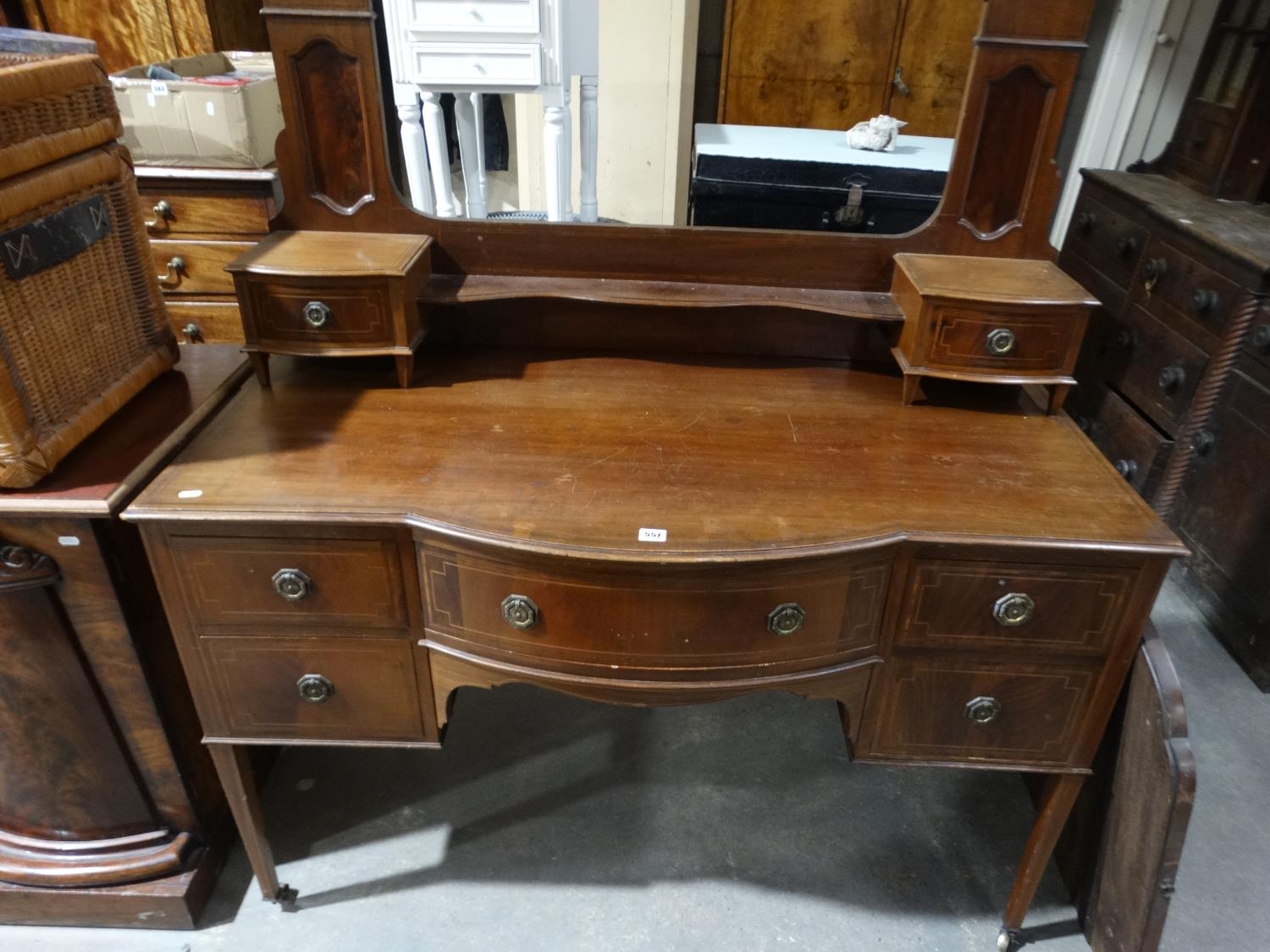 An Edwardian Mahogany Bow Front Mirrored Dressing Chest