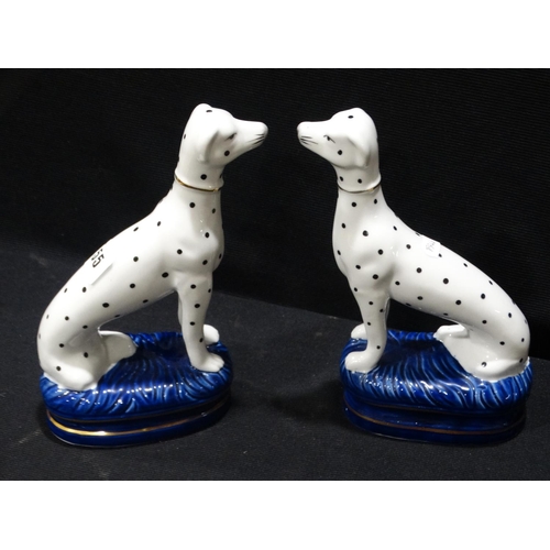 55 - A Pair Of Reproduction Staffordshire Pottery Seated Dalmatians