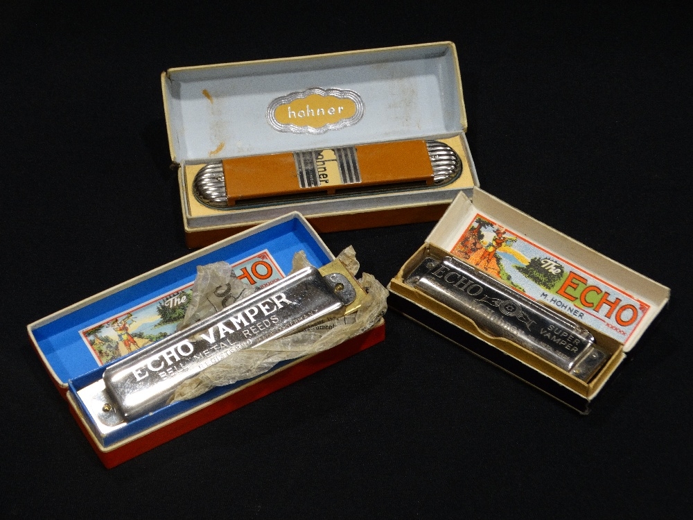 Three Hohner Mouth Organs