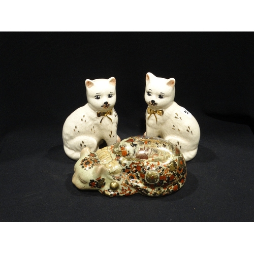 31 - A Pair Of Reproduction Staffordshire Pottery Seated Cats, Together With An Oriental Decorated Cat