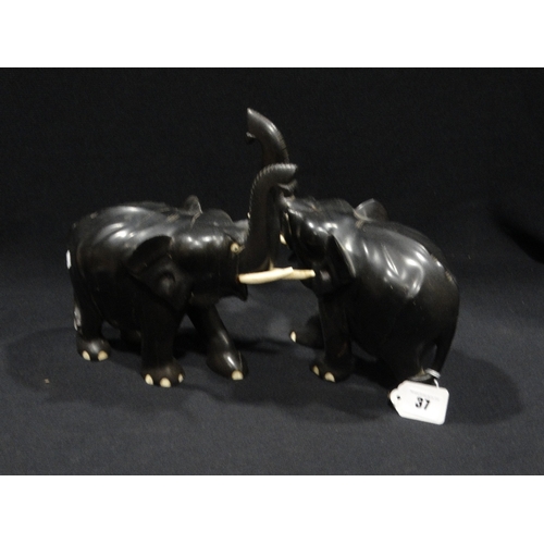 37 - A Pair Of Antique Ebonized Elephants