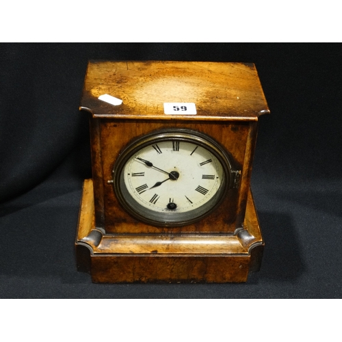 59 - An Antique Walnut Veneer Mantel Clock