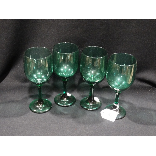 47 - A Set Of Eight Green Tinted Wine Glasses