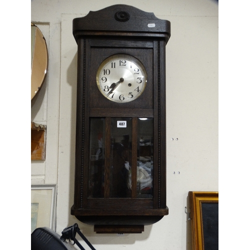 A Polished Oak Pendulum Wall Clock