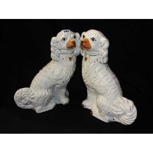 302 - A Pair Of Staffordshire Pottery White Seated Dogs