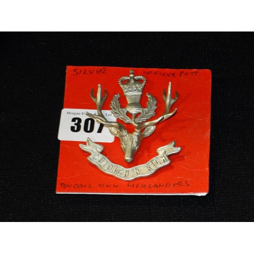 307 - A Silver Queen`s Own Highlanders Cap Badge