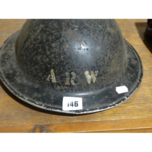 146 - A 2nd World War Air Raid Wardens Helmet, Together With A Further Military Helmet