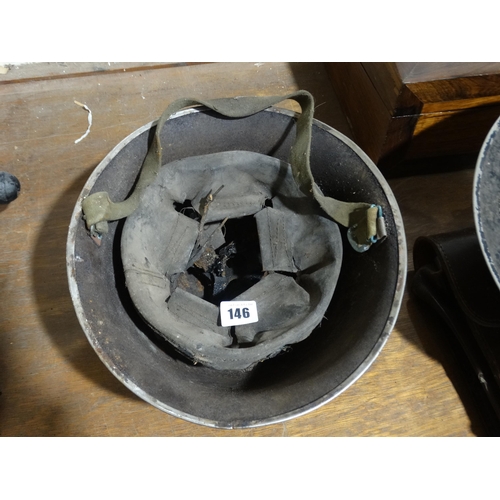 146 - A 2nd World War Air Raid Wardens Helmet, Together With A Further Military Helmet