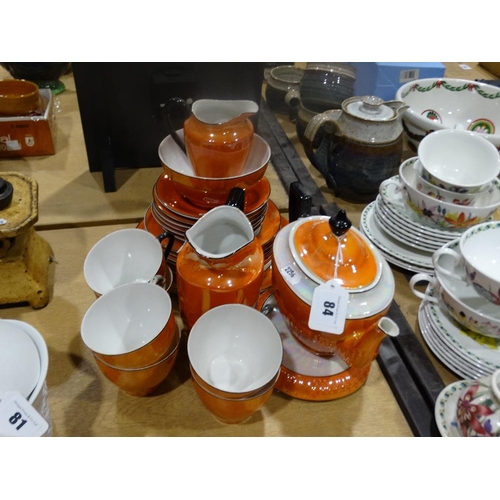 84 - A Twenty-Four Piece Orange Lustre Decorated Tea Set