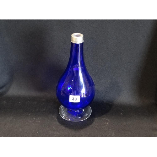 33 - A Circular Based Blue Glass & Silver Collared Narrow Necked Vase, 11