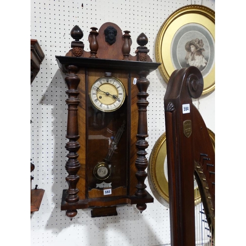 592 - An Edwardian Pendulum Wall Clock With Circular Dial