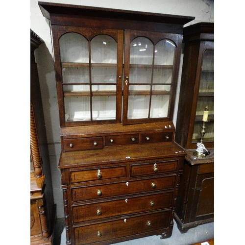 599 - An Antique Oak & Mahogany Bookcase Chest With Central Bank Of Three Drawers