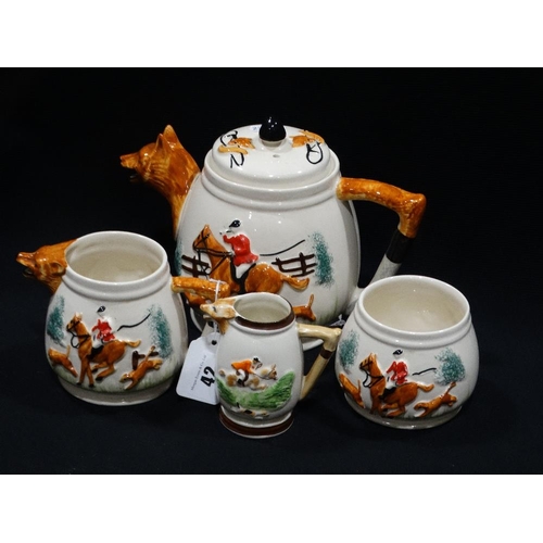 42 - A Four Piece Pottery Hunting Theme Tea Service