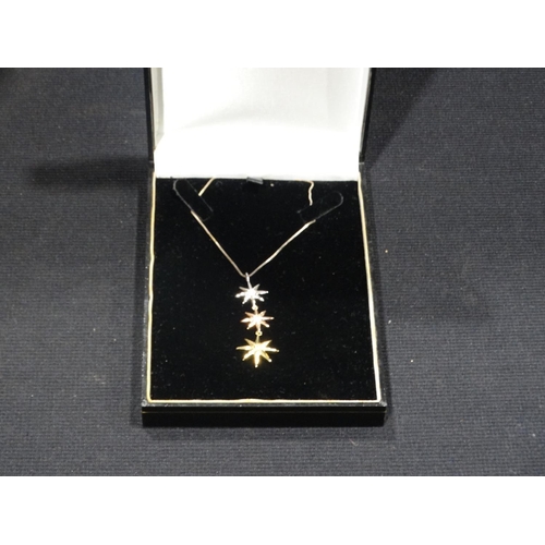 253 - A Silver & Gold Plated Diamond Three Star Pendant On A Silver Chain