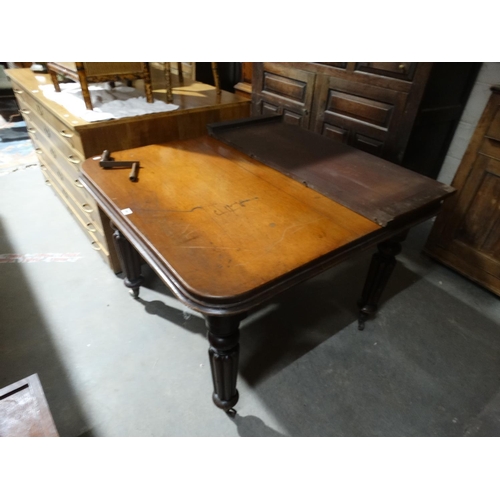 561 - A Late Victorian Mahogany Extending Dining Table On Reeded Supports