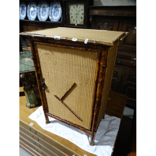 562 - An Early 20thc Bamboo Single Door Cabinet, Together With A Similar Two Tier Table