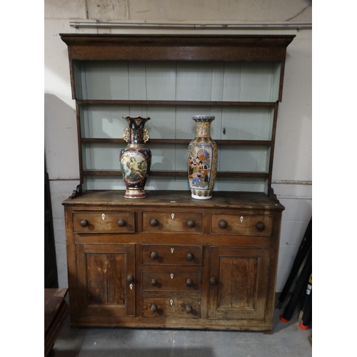 589 - An Antique Anglesey Oak Welsh Dresser Having A Three Shelf Rack, 60