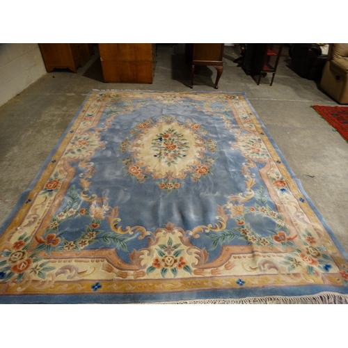 549 - A Blue Ground Floral Decorated Chinese Woollen Carpet, Approx 140 X 104