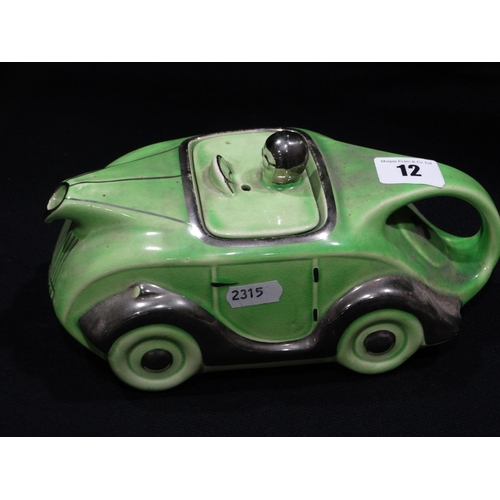 12 - A Sadler Green Glazed And Silver Lustre Racing Car Teapot