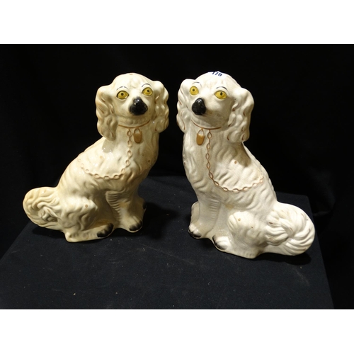 178 - A Pair Of Staffordshire Pottery White Seated Dogs