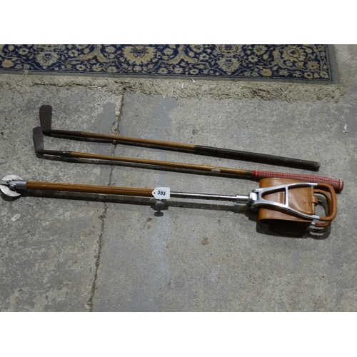 303 - Two Wooden Shafted Golf Clubs With A Shooting Stick