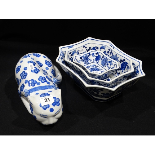 31 - A Blue And White Ceramic Cat Together With A Set Of Three Bowls