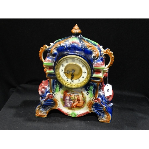 57 - An Edwardian Pottery Encased Mantel Clock With Circular Dial