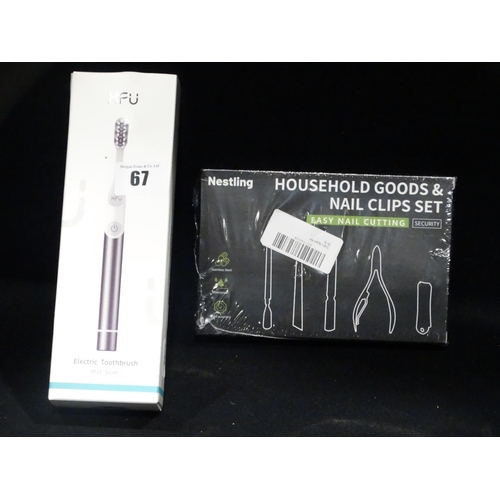 67 - A New And Boxed Electric Toothbrush With A Nail Clipping Set