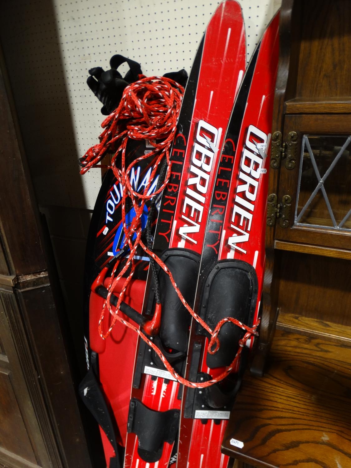 A Pair Of Water Skis Together With A Kneel Board