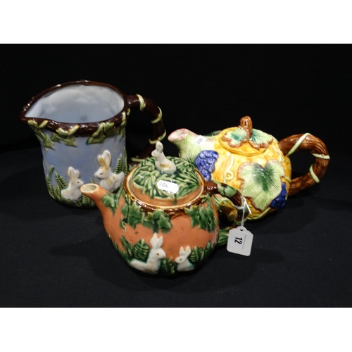 12 - Three Majolica Type Glazed Teapots & Jug