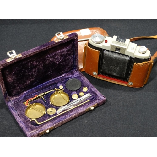 24 - A Vintage Camera, Together With A Cased Balance Scale