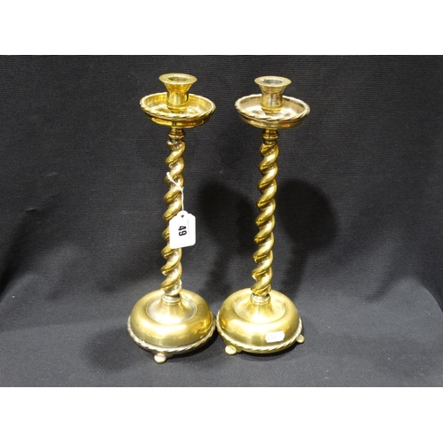 49 - A Pair Of Circular Based Brass Barley Twist Column Candlesticks