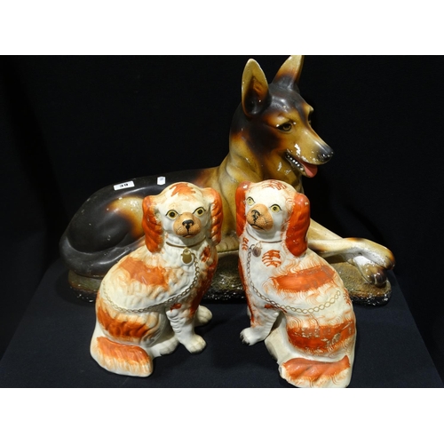 39 - An Early 20thc Plasterwork Model Of A German Shepherd, Together With A Pair Of Red & White Staffords... 