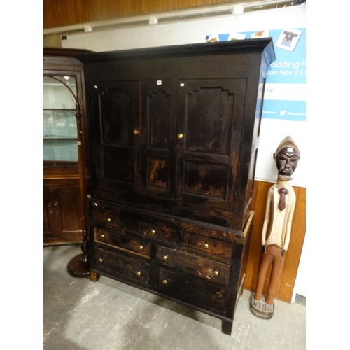 694 - An Antique Oak Press Cupboard With Four Drawers To The Base