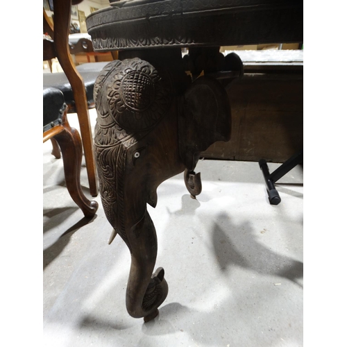 627 - An Early 20thc Carved Indian Hardwood Circular Topped Table On Elephant Head Supports