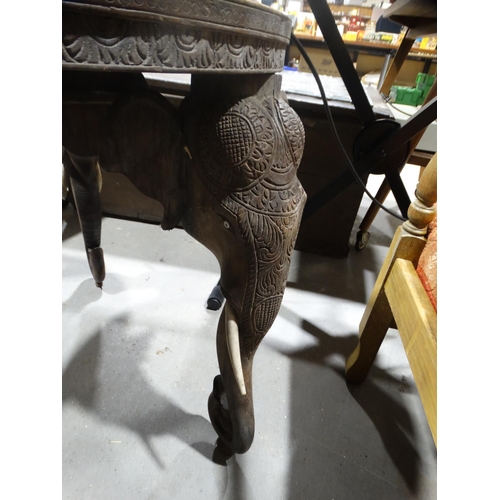 627 - An Early 20thc Carved Indian Hardwood Circular Topped Table On Elephant Head Supports