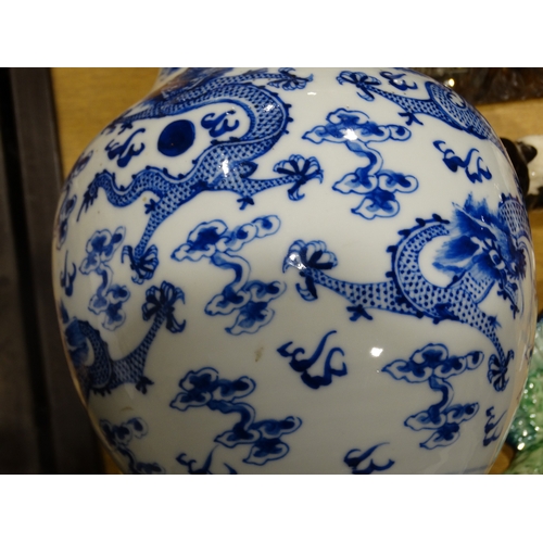 41 - A Circular Based Chinese Blue & White Narrow Necked Vase, The Body Decorated With Dragons Amongst Cl... 