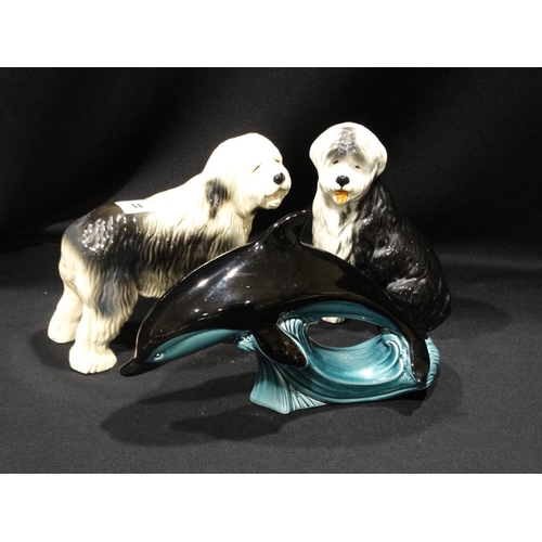 11 - A Poole Pottery Dolphin, Together With Two Pottery Dogs