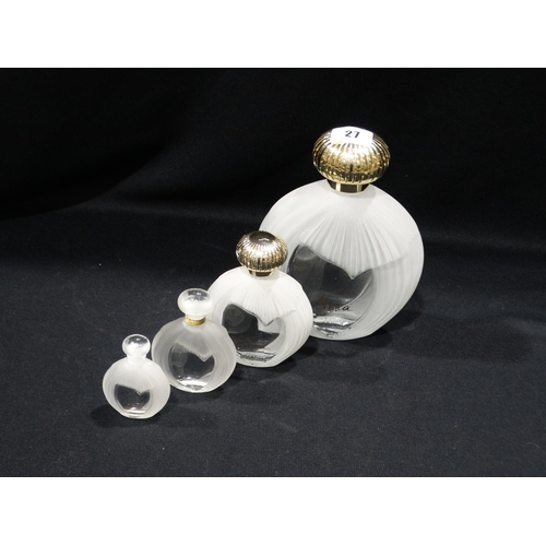 27 - Four Graduated Nina Ricci Perfume Bottles By Lalique