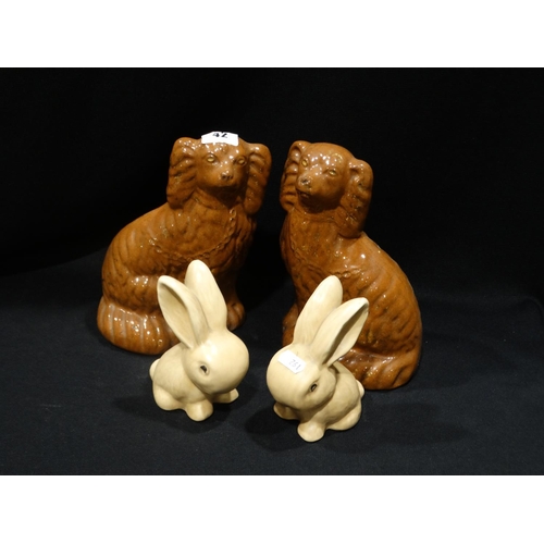 42 - A Pair Of Staffordshire Pottery Dogs, Together With A Pair Of Sylvac Rabbits