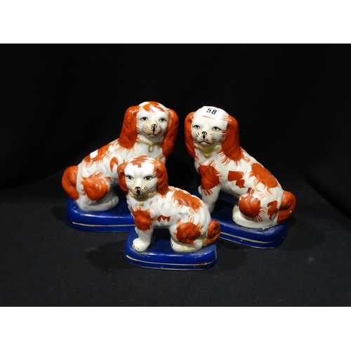 58 - Three Staffordshire Pottery Style Red & White Seated Dogs