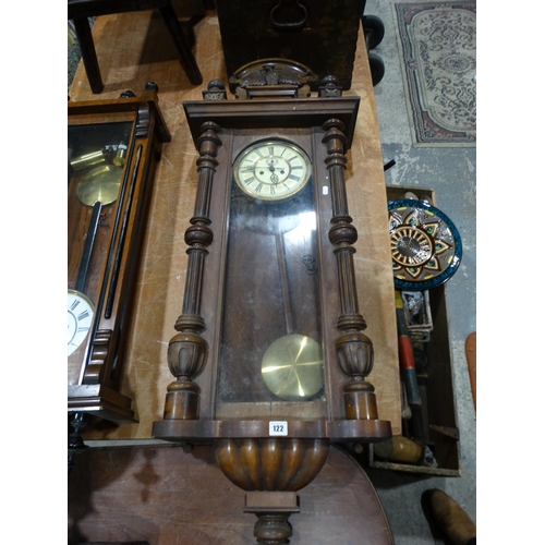 122 - An Antique Pendulum Wall Clock With Circular Dial