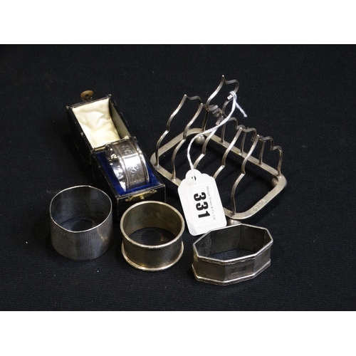 331 - A Silver Toast Rack, Together With Four Silver Serviette Rings