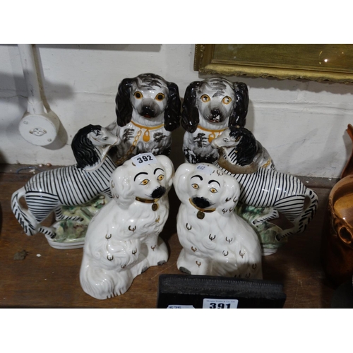 392 - Two Pairs Of Staffordshire Pottery Seated Dogs, Together With A Pair Of Zebras