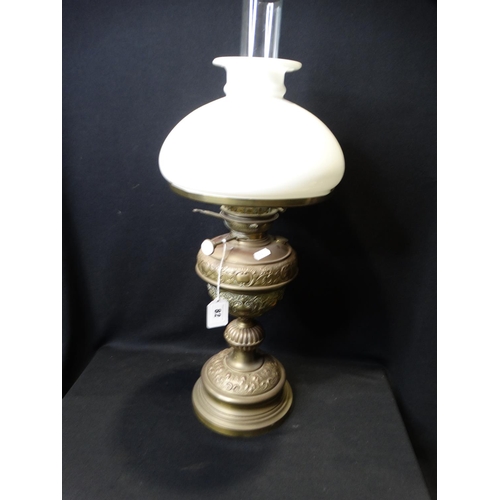 82 - A Circular Based Moulded Oil Lamp With Milk Glass Shade