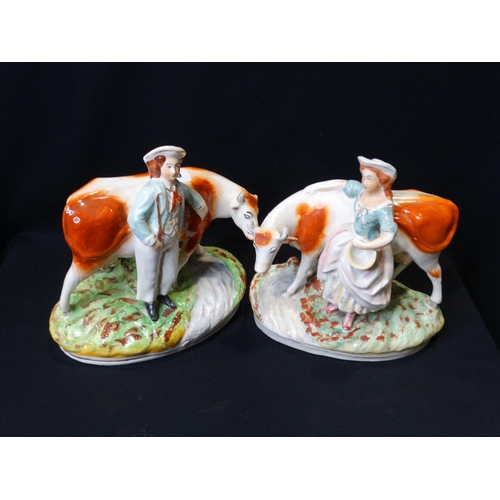 65 - A Pair Of Staffordshire Pottery Cow & Milk Hand Groups (Af)