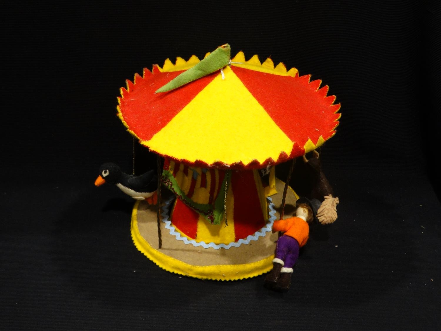 A Vintage Felt Covered Model Carousel