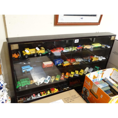 A Display Case Of Model Vehicles